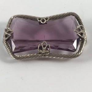 Vintage Brooch with purple cut stone.